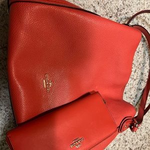 EUC  Coral color coach Edie handbag with matching wallet.
